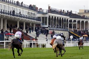LUDLOW, ENGLAND - DECEMBER 02: Racegoers watch from the grand stand at Ludlow Racecourse on December 2, 2020 in Ludlow, England. (Photo by David Davies - Pool/Getty Images)