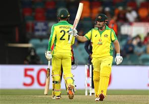 CANBERRA, AUSTRALIA - DECEMBER 02: Aaron Finch of Australia celebrates after reaching his half century during game three of the One Day International series between Australia and India at Manuka Oval on December 02, 2020 in Canberra, Australia. (Photo by Ryan Pierse/Getty Images)