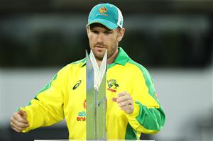 CANBERRA, AUSTRALIA - DECEMBER 02: Aaron Finch of Australia takes the trophy after Australia won the series 2-1 during game three of the One Day International series between Australia and India at Manuka Oval on December 02, 2020 in Canberra, Australia. (Photo by Mark Kolbe/Getty Images)