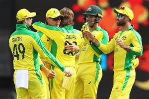 CANBERRA, AUSTRALIA - DECEMBER 02: Marnus Labuschagne and Adam Zampa of Australia celebrate with their team mates after combining to take the wicket of Shreyas Iyer of India during game three of the One Day International series between Australia and India at Manuka Oval on December 02, 2020 in Canberra, Australia. (Photo by Mark Kolbe/Getty Images)