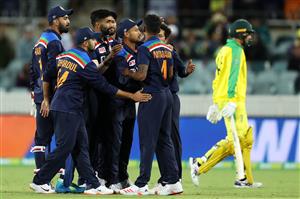 CANBERRA, AUSTRALIA - DECEMBER 02: Thangarasu Natarajan of India celebrates with his team after taking the wicket of Ashton Agar of Australia of Australia during game three of the One Day International series between Australia and India at Manuka Oval on December 02, 2020 in Canberra, Australia. (Photo by Mark Kolbe/Getty Images)