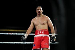 BRISBANE, AUSTRALIA - DECEMBER 03: Justis Huni during his fight against Arsene Fosso in the Australian Heavyweight Title fight at Fortitude Music Hall on December 03, 2020 in Brisbane, Australia. (Photo by Chris Hyde/Getty Images)