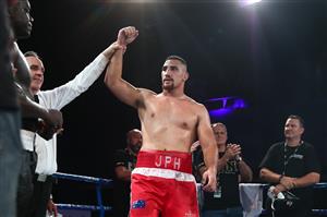 BRISBANE, AUSTRALIA - DECEMBER 03: Justis Huni celebrates winning aginst Arsene Fosso during the Australian Heavyweight Title fight at Fortitude Music Hall on December 03, 2020 in Brisbane, Australia. (Photo by Chris Hyde/Getty Images)