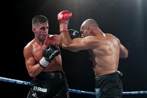 BRISBANE, AUSTRALIA - DECEMBER 03: Issac Hardman punches Tej Pratap Singh during their Middleweight fight at Fortitude Music Hall on December 03, 2020 in Brisbane, Australia. (Photo by Chris Hyde/Getty Images)