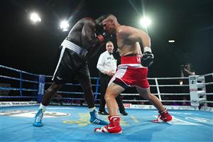 BRISBANE, AUSTRALIA - DECEMBER 03: Justis Huni punches Arsene Fosso during the Australian Heavyweight Title fight at Fortitude Music Hall on December 03, 2020 in Brisbane, Australia. (Photo by Chris Hyde/Getty Images)