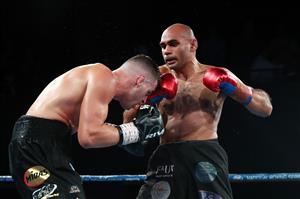 BRISBANE, AUSTRALIA - DECEMBER 03: Tej Pratap Singh punches Issac Hardman during their Middleweight fight at Fortitude Music Hall on December 03, 2020 in Brisbane, Australia. (Photo by Chris Hyde/Getty Images)