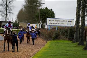 WINCANTON, ENGLAND - DECEMBER 03: A general view as runners leave the parade ring for The Visit racingtv.com Amateur Jockeys' Handicap Chase at Wincanton Racecourse on December 03, 2020 in Wincanton, England. Owners and a limited number of the public are allowed to attend the meeting due to the Coronavirus pandemic. (Photo by Alan Crowhurst/Getty Images)