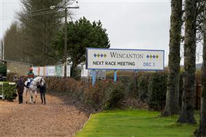 WINCANTON, ENGLAND - DECEMBER 03: A general view as runners leave the parade ring for The Visit racingtv.com Amateur Jockeys' Handicap Chase at Wincanton Racecourse on December 03, 2020 in Wincanton, England. Owners and a limited number of the public are allowed to attend the meeting due to the Coronavirus pandemic. (Photo by Alan Crowhurst/Getty Images)