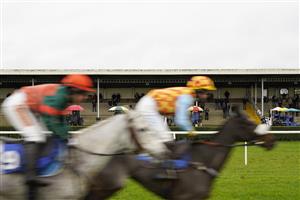WINCANTON, ENGLAND - DECEMBER 03: A general view as bookmakers and the paying public watch the action during The Visit racingtv.com Amateur Jockeys' Handicap Chase at Wincanton Racecourse on December 03, 2020 in Wincanton, England. Owners and a limited number of the public are allowed to attend the meeting due to the Coronavirus pandemic. (Photo by Alan Crowhurst/Getty Images)