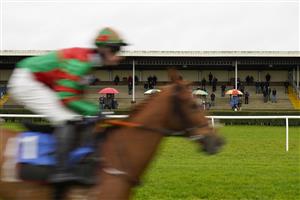 WINCANTON, ENGLAND - DECEMBER 03: A general view as bookmakers and the paying public watch the action during The Visit racingtv.com Amateur Jockeys' Handicap Chase at Wincanton Racecourse on December 03, 2020 in Wincanton, England. Owners and a limited number of the public are allowed to attend the meeting due to the Coronavirus pandemic. (Photo by Alan Crowhurst/Getty Images)
