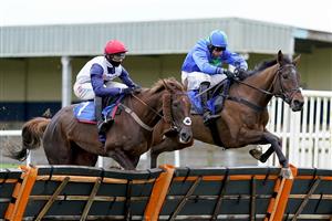 WINCANTON, ENGLAND - DECEMBER 03: Harry Skelton riding Global Harmony (R) clear the last to win The Watch Racing TV In Stunning HD Mares' Novices' Hurdle at Wincanton Racecourse on December 03, 2020 in Wincanton, England. Owners and a limited number of the public are allowed to attend the meeting due to the Coronavirus pandemic. (Photo by Alan Crowhurst/Getty Images)