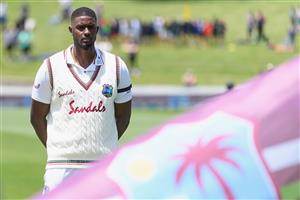HAMILTON, NEW ZEALAND - DECEMBER 03: Captain Jason Holder of the West Indies and his team mates line up for their national anthem during day one of the First Test match in the series between New Zealand and the West Indies at Seddon Park on December 03, 2020 in Hamilton, New Zealand. (Photo by Kai Schwoerer/Getty Images)
