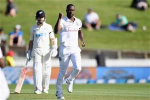 HAMILTON, NEW ZEALAND - DECEMBER 03: Kemar Roach of the West Indies celebrates after dismissing Tom Latham of New Zealand during day one of the First Test match in the series between New Zealand and the West Indies at Seddon Park on December 03, 2020 in Hamilton, New Zealand. (Photo by Kai Schwoerer/Getty Images)