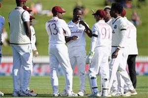 HAMILTON, NEW ZEALAND - DECEMBER 03: Kemar Roach of the West Indies (C) is congratulated by team mates after dismissing Tom Latham of New Zealand during day one of the First Test match in the series between New Zealand and the West Indies at Seddon Park on December 03, 2020 in Hamilton, New Zealand. (Photo by Kai Schwoerer/Getty Images)