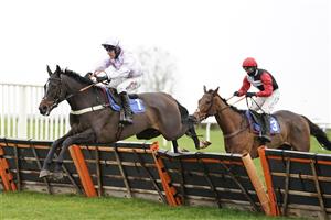 WINCANTON, ENGLAND - DECEMBER 03: Robbie Power riding Striking A Pose (L) clear the last to win The Racing TV Profits Returned To Racing 'National Hunt' Novices' Handicap Hurdle at Wincanton Racecourse on December 03, 2020 in Wincanton, England. Owners and a limited number of the public are allowed to attend the meeting due to the Coronavirus pandemic. (Photo by Alan Crowhurst/Getty Images)