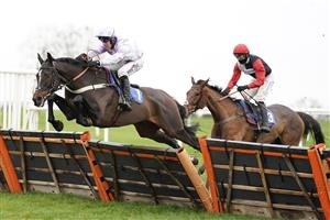 WINCANTON, ENGLAND - DECEMBER 03: Robbie Power riding Striking A Pose (L) clear the last to win The Racing TV Profits Returned To Racing 'National Hunt' Novices' Handicap Hurdle at Wincanton Racecourse on December 03, 2020 in Wincanton, England. Owners and a limited number of the public are allowed to attend the meeting due to the Coronavirus pandemic. (Photo by Alan Crowhurst/Getty Images)