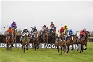 WINCANTON, ENGLAND - DECEMBER 03: Robbie Power riding Darlac (C, yellow/purple) on their way to winning The Weatherbys Racing Bank Silver Buck Handicap Chase at Wincanton Racecourse on December 03, 2020 in Wincanton, England. Owners and a limited number of the public are allowed to attend the meeting due to the Coronavirus pandemic. (Photo by Alan Crowhurst/Getty Images)