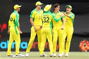 CANBERRA, AUSTRALIA - DECEMBER 02: Sean Abbott of Australia celebrates with his team after taking the wicket of Shikhar Dhawan of India during game three of the One Day International series between Australia and India at Manuka Oval on December 02, 2020 in Canberra, Australia. (Photo by Mark Kolbe/Getty Images)