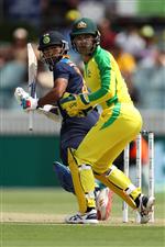 CANBERRA, AUSTRALIA - DECEMBER 02: Shikhar Dhawan of India and Alex Carey of Australia watch the ball during game three of the One Day International series between Australia and India at Manuka Oval on December 02, 2020 in Canberra, Australia. (Photo by Mark Kolbe/Getty Images)