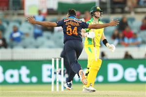CANBERRA, AUSTRALIA - DECEMBER 02: Sharldul Thakur of India celebrates taking the wicket of Steve Smith of Australia during game three of the One Day International series between Australia and India at Manuka Oval on December 02, 2020 in Canberra, Australia. (Photo by Mark Kolbe/Getty Images)