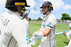HAMILTON, NEW ZEALAND - DECEMBER 03: Openers Tom Latham and Will Young of New Zealand (L-R) glove up before taking the field during day one of the First Test match in the series between New Zealand and the West Indies at Seddon Park on December 03, 2020 in Hamilton, New Zealand. (Photo by Kai Schwoerer/Getty Images)
