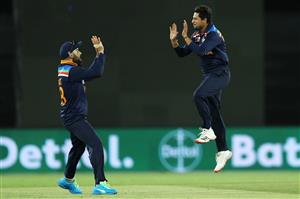 CANBERRA, AUSTRALIA - DECEMBER 02: Virat Kohli and Kuldeep Yadav of India celebrates Yadav taking the wicket of Cameron Green of Australia during game three of the One Day International series between Australia and India at Manuka Oval on December 02, 2020 in Canberra, Australia. (Photo by Mark Kolbe/Getty Images)