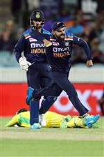 CANBERRA, AUSTRALIA - DECEMBER 02: (EDITORS NOTE: Retransmission with alternate crop.) Virat Kohli of India celebrates the run out of Alex Carey of Australia during game three of the One Day International series between Australia and India at Manuka Oval on December 02, 2020 in Canberra, Australia. (Photo by Mark Kolbe/Getty Images)