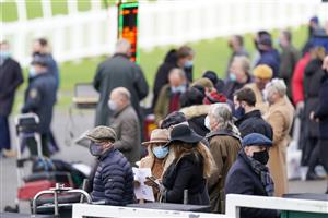 ESHER, ENGLAND - DECEMBER 04: A general view as the crowd wear their face coverings at Sandown Park on December 04, 2020 in Esher, England. Owners and a limited number of the public are allowed to attend the meeting due to the Coronavirus pandemic. (Photo by Alan Crowhurst/Getty Images)