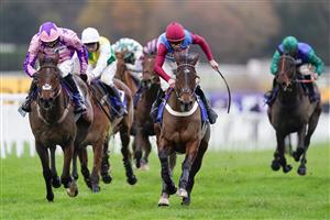 ESHER, ENGLAND - DECEMBER 04: Gavin Sheehan riding Portrush Ted (maroon/blue) clear the last to win The Pertemps Network Handicap Hurdle at Sandown Park on December 04, 2020 in Esher, England. Owners and a limited number of the public are allowed to attend the meeting due to the Coronavirus pandemic. (Photo by Alan Crowhurst/Getty Images)