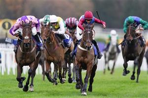ESHER, ENGLAND - DECEMBER 04: Gavin Sheehan riding Portrush Ted (maroon/blue) clear the last to win The Pertemps Network Handicap Hurdle at Sandown Park on December 04, 2020 in Esher, England. Owners and a limited number of the public are allowed to attend the meeting due to the Coronavirus pandemic. (Photo by Alan Crowhurst/Getty Images)