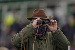 ESHER, ENGLAND - DECEMBER 04: Watching the action through binoculars at Sandown Park on December 04, 2020 in Esher, England. Owners and a limited number of the public are allowed to attend the meeting due to the Coronavirus pandemic. (Photo by Alan Crowhurst/Getty Images)
