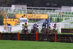 ESHER, ENGLAND - DECEMBER 04: Lucy Gardner riding Emmpressive Lady (blue/white) clear the last to win The Listen To Weighed-In Podcast On Betfair Mares' Handicap Hurdle at Sandown Park on December 04, 2020 in Esher, England. Owners and a limited number of the public are allowed to attend the meeting due to the Coronavirus pandemic. (Photo by Alan Crowhurst/Getty Images)