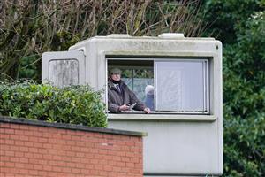 ESHER, ENGLAND - DECEMBER 04: A steward watches the race from his vantage point at Sandown Park on December 04, 2020 in Esher, England. Owners and a limited number of the public are allowed to attend the meeting due to the Coronavirus pandemic. (Photo by Alan Crowhurst/Getty Images)