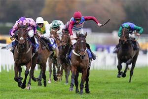 ESHER, ENGLAND - DECEMBER 04: Gavin Sheehan riding Portrush Ted (maroon/blue) clear the last to win The Pertemps Network Handicap Hurdle at Sandown Park on December 04, 2020 in Esher, England. Owners and a limited number of the public are allowed to attend the meeting due to the Coronavirus pandemic. (Photo by Alan Crowhurst/Getty Images)