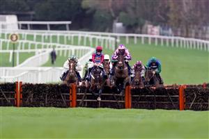 ESHER, ENGLAND - DECEMBER 04: Gavin Sheehan riding Portrush Ted (maroon/blue) clear the last to win The Pertemps Network Handicap Hurdle at Sandown Park on December 04, 2020 in Esher, England. Owners and a limited number of the public are allowed to attend the meeting due to the Coronavirus pandemic. (Photo by Alan Crowhurst/Getty Images)