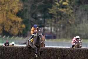 ESHER, ENGLAND - DECEMBER 04: Harry Skelton riding Alnadam (orange) clear the last to win The My Oddsboost On Betfair Novices' Limited Handicap Chase at Sandown Park on December 04, 2020 in Esher, England. Owners and a limited number of the public are allowed to attend the meeting due to the Coronavirus pandemic. (Photo by Alan Crowhurst/Getty Images)