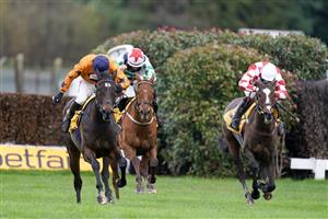ESHER, ENGLAND - DECEMBER 04: Harry Skelton riding Alnadam (orange) clear the last to win The My Oddsboost On Betfair Novices' Limited Handicap Chase at Sandown Park on December 04, 2020 in Esher, England. Owners and a limited number of the public are allowed to attend the meeting due to the Coronavirus pandemic. (Photo by Alan Crowhurst/Getty Images)