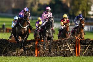 ESHER, ENGLAND - DECEMBER 05: Paddy Brennan riding Elham Valley (pink, pink cap) clear the last to win The Betfair Free Bet On The 1.50 Introductory Juvenile Hurdle at Sandown Park on December 05, 2020 in Esher, England. Owners and a limited number of the public are allowed to attend the meeting due to the Coronavirus pandemic. (Photo by Alan Crowhurst/Getty Images)