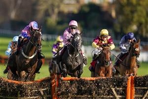 ESHER, ENGLAND - DECEMBER 05: Paddy Brennan riding Elham Valley (pink, pink cap) clear the last to win The Betfair Free Bet On The 1.50 Introductory Juvenile Hurdle at Sandown Park on December 05, 2020 in Esher, England. Owners and a limited number of the public are allowed to attend the meeting due to the Coronavirus pandemic. (Photo by Alan Crowhurst/Getty Images)
