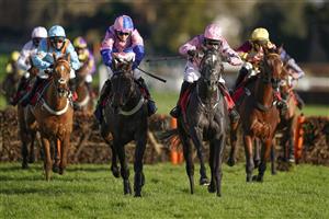 ESHER, ENGLAND - DECEMBER 05: Paddy Brennan riding Elham Valley (pink, pink cap) clear the last to win The Betfair Free Bet On The 1.50 Introductory Juvenile Hurdle at Sandown Park on December 05, 2020 in Esher, England. Owners and a limited number of the public are allowed to attend the meeting due to the Coronavirus pandemic. (Photo by Alan Crowhurst/Getty Images)