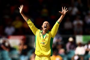 CANBERRA, AUSTRALIA - DECEMBER 02: Ashton Agar of Australia celebrates after taking the wicket of KL Rahul of India during game three of the One Day International series between Australia and India at Manuka Oval on December 02, 2020 in Canberra, Australia. (Photo by Ryan Pierse/Getty Images)