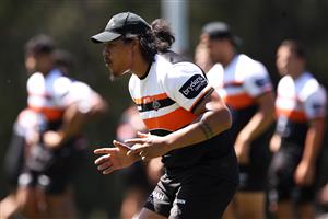 SYDNEY, AUSTRALIA - DECEMBER 07: Luciano Leilua runs during a drill at the Wests Tigers NRL training session at St. Luke's Park North on December 07, 2020 in Sydney, Australia. (Photo by Mark Kolbe/Getty Images)