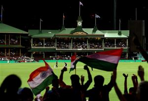 SYDNEY, AUSTRALIA - DECEMBER 06: Indian fans show their support during game two of the Twenty20 International series between Australia and India at Sydney Cricket Ground on December 06, 2020 in Sydney, Australia. (Photo by Ryan Pierse/Getty Images)