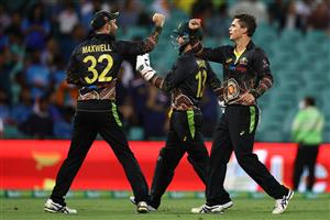 SYDNEY, AUSTRALIA - DECEMBER 06: Mitch Swepson of Australia is congratulated by team mates after getting the wicket of Sanju Samson of India during game two of the Twenty20 International series between Australia and India at Sydney Cricket Ground on December 06, 2020 in Sydney, Australia. (Photo by Ryan Pierse/Getty Images)