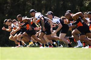 SYDNEY, AUSTRALIA - DECEMBER 07: The Tigers players run during a drill at the Wests Tigers NRL training session at St. Luke's Park North on December 07, 2020 in Sydney, Australia. (Photo by Mark Kolbe/Getty Images)
