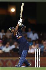 SYDNEY, AUSTRALIA - DECEMBER 06: Hardik Pandya of India hits a six to win game two of the Twenty20 International series between Australia and India at Sydney Cricket Ground on December 06, 2020 in Sydney, Australia. (Photo by Ryan Pierse/Getty Images)