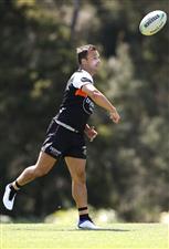 SYDNEY, AUSTRALIA - DECEMBER 07: Luke Brooks bowls a football during the Wests Tigers NRL training session at St. Luke's Park North on December 07, 2020 in Sydney, Australia. (Photo by Mark Kolbe/Getty Images)