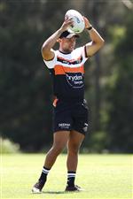 SYDNEY, AUSTRALIA - DECEMBER 07: Moses Mbye holds up a ball during the Wests Tigers NRL training session at St. Luke's Park North on December 07, 2020 in Sydney, Australia. (Photo by Mark Kolbe/Getty Images)