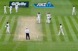 HAMILTON, NEW ZEALAND - DECEMBER 06: General view as Shannon Gabriel of the West Indies looks dejected after being dismissed by Neil Wagner of New Zealand, who is congratulated by Will Young of New Zealand (L-R) on taking the final wicket during day four of the First Test match in the series between New Zealand and the West Indies at Seddon Park on December 06, 2020 in Hamilton, New Zealand. (Photo by Kai Schwoerer/Getty Images)
