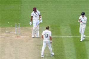 HAMILTON, NEW ZEALAND - DECEMBER 06: Shannon Gabriel of the West Indies looks dejected after being dismissed by Neil Wagner of New Zealand, who is congratulated by Will Young of New Zealand (L-R) on taking the final wicket during day four of the First Test match in the series between New Zealand and the West Indies at Seddon Park on December 06, 2020 in Hamilton, New Zealand. (Photo by Kai Schwoerer/Getty Images)